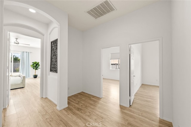 40065 Temple Ct, Murrieta, CA 92563 - hall with arched walkways and light wood-style floors