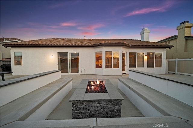 40065 Temple Ct, Murrieta, CA 92563 - back of property featuring a fire pit, a tile roof, a patio, and stucco siding