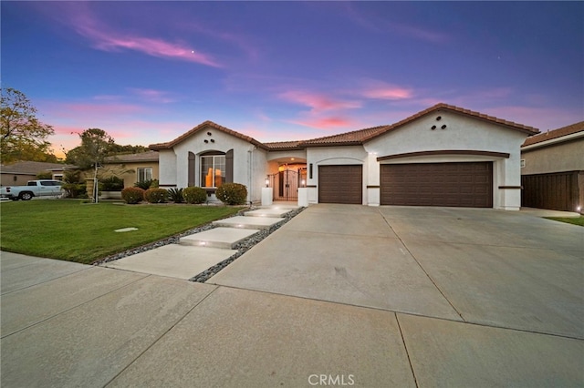 40065 Temple Ct, Murrieta, CA 92563 - mediterranean / spanish house featuring a garage, driveway, a front lawn, and stucco siding