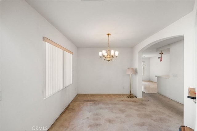 39513 Daylily Pl, Palmdale, CA 93551 - carpeted spare room featuring a chandelier and arched walkways
