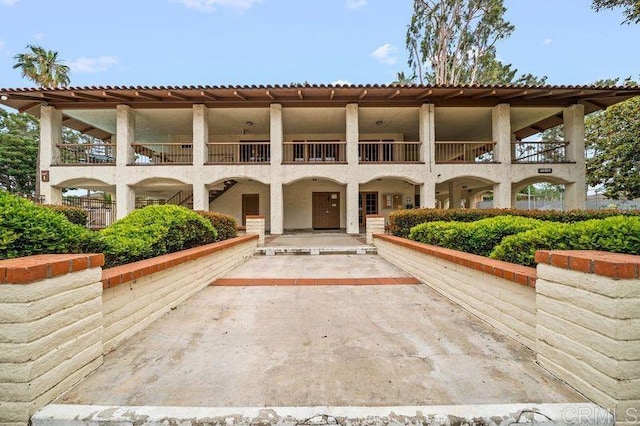 6009 Rancho Mission Rd Unit 102, San Diego, CA 92108 - rear view of house featuring a balcony