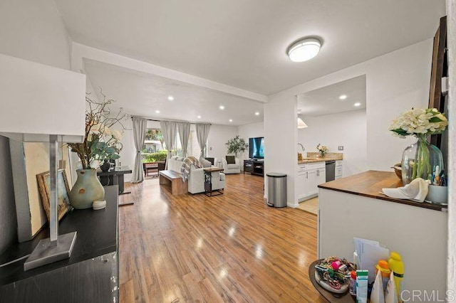 6009 Rancho Mission Rd Unit 102, San Diego, CA 92108 - living area with light wood finished floors and recessed lighting