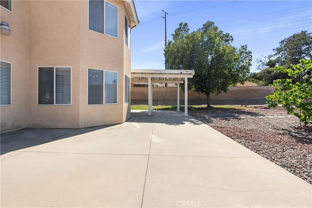 6879 Mission Grove Pkwy N, Riverside, CA 92506 - fenced backyard featuring a patio