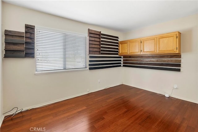 6879 Mission Grove Pkwy N, Riverside, CA 92506 - unfurnished room with dark wood finished floors and baseboards