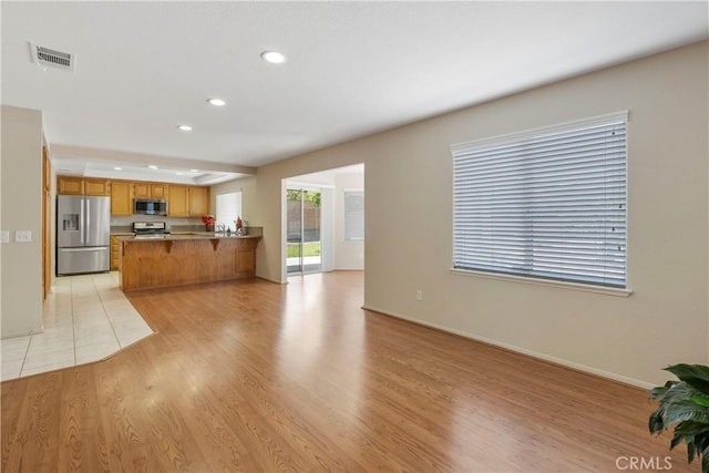 6879 Mission Grove Pkwy N, Riverside, CA 92506 - living area with light wood-type flooring and recessed lighting