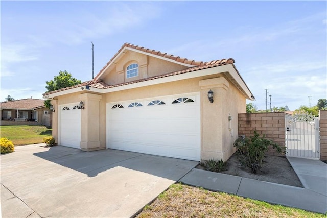 6879 Mission Grove Pkwy N, Riverside, CA 92506 - view of front of property with stucco siding, a garage, a gate, and driveway