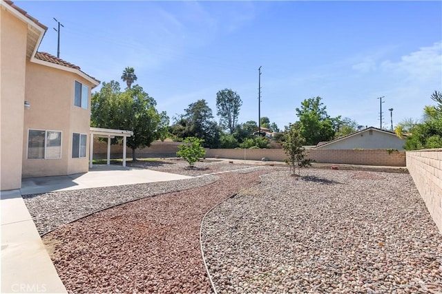 6879 Mission Grove Pkwy N, Riverside, CA 92506 - fenced backyard featuring a patio