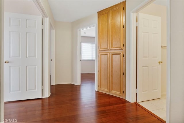 6879 Mission Grove Pkwy N, Riverside, CA 92506 - hallway featuring wood finished floors and baseboards