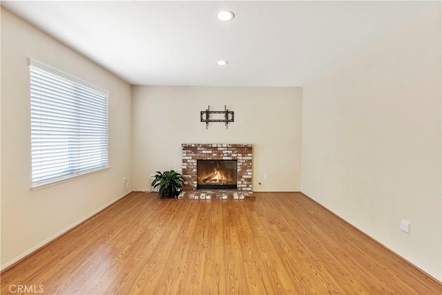 6879 Mission Grove Pkwy N, Riverside, CA 92506 - living area with wood finished floors, a brick fireplace, and recessed lighting