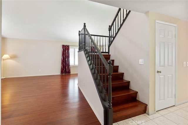 6879 Mission Grove Pkwy N, Riverside, CA 92506 - stairs featuring baseboards and wood finished floors