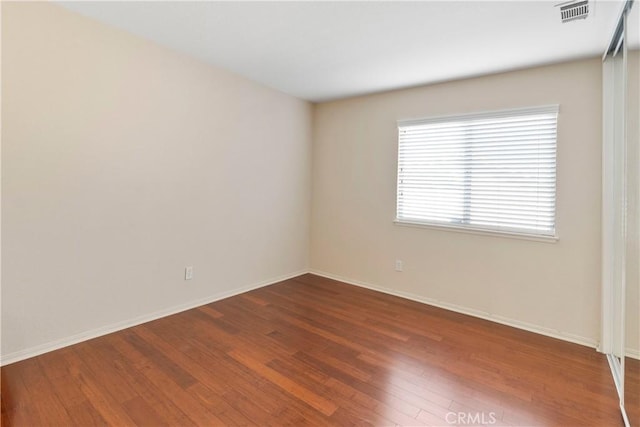 6879 Mission Grove Pkwy N, Riverside, CA 92506 - spare room with wood finished floors and baseboards