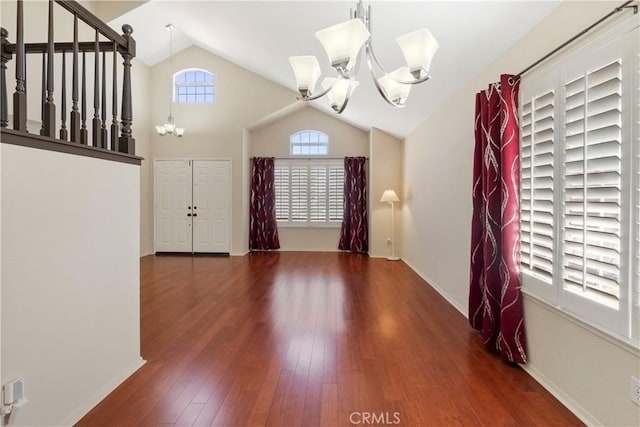 6879 Mission Grove Pkwy N, Riverside, CA 92506 - entryway featuring a chandelier, vaulted ceiling, and wood finished floors