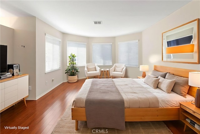 6879 Mission Grove Pkwy N, Riverside, CA 92506 - bedroom with wood finished floors and baseboards