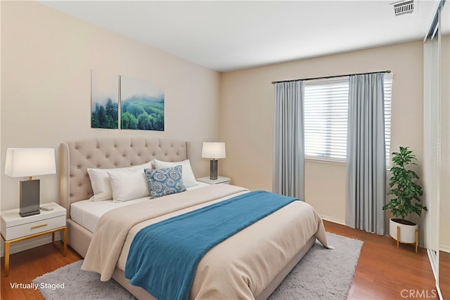 6879 Mission Grove Pkwy N, Riverside, CA 92506 - bedroom featuring wood finished floors and baseboards