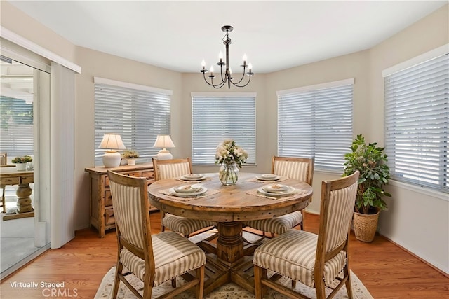 6879 Mission Grove Pkwy N, Riverside, CA 92506 - dining area with a chandelier and light wood-type flooring