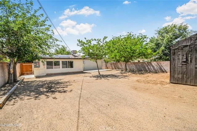 37858 10th St E, Palmdale, CA 93550 - rear view of property with solar panels, a fenced backyard, and a patio area