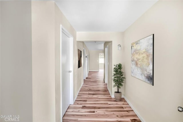 37858 10th St E, Palmdale, CA 93550 - hallway featuring light wood-style flooring and baseboards