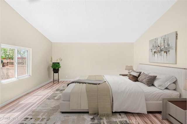 37858 10th St E, Palmdale, CA 93550 - bedroom featuring wood finished floors and high vaulted ceiling