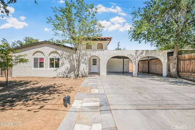 37858 10th St E, Palmdale, CA 93550 - mediterranean / spanish-style home featuring stucco siding, a tiled roof, and driveway