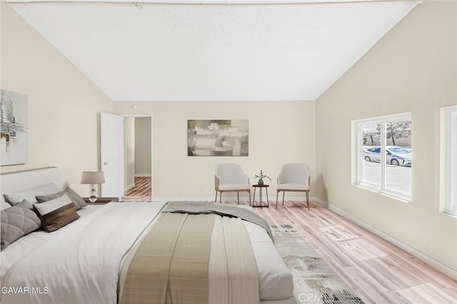 37858 10th St E, Palmdale, CA 93550 - bedroom featuring light wood finished floors and high vaulted ceiling