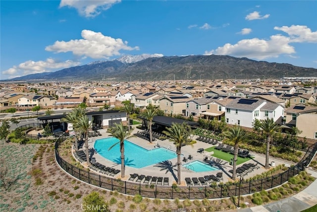 16540 Wyndham Ln Unit 10, Fontana, CA 92336 - community pool featuring a residential view, a mountain view, and a patio area