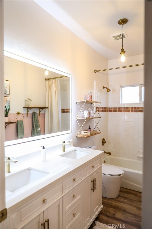1639 La Selva Ave, Grover Beach, CA 93433 - bathroom with double vanity, wood finished floors, and shower / tub combo