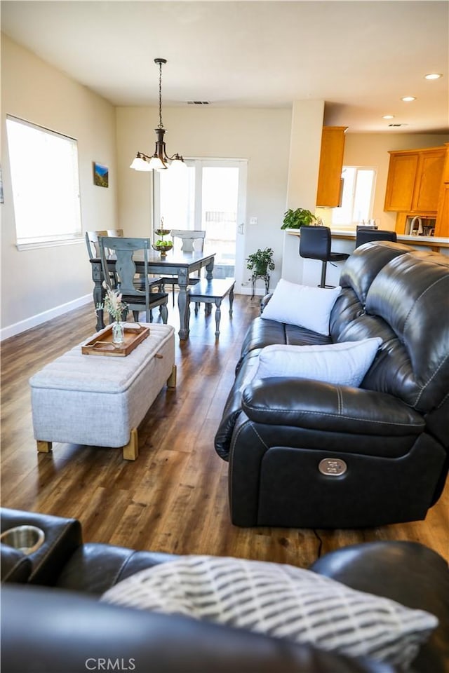 1639 La Selva Ave, Grover Beach, CA 93433 - living area with healthy amount of natural light, dark wood-style flooring, recessed lighting, and a chandelier
