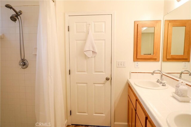 1639 La Selva Ave, Grover Beach, CA 93433 - bathroom featuring double vanity and tiled shower