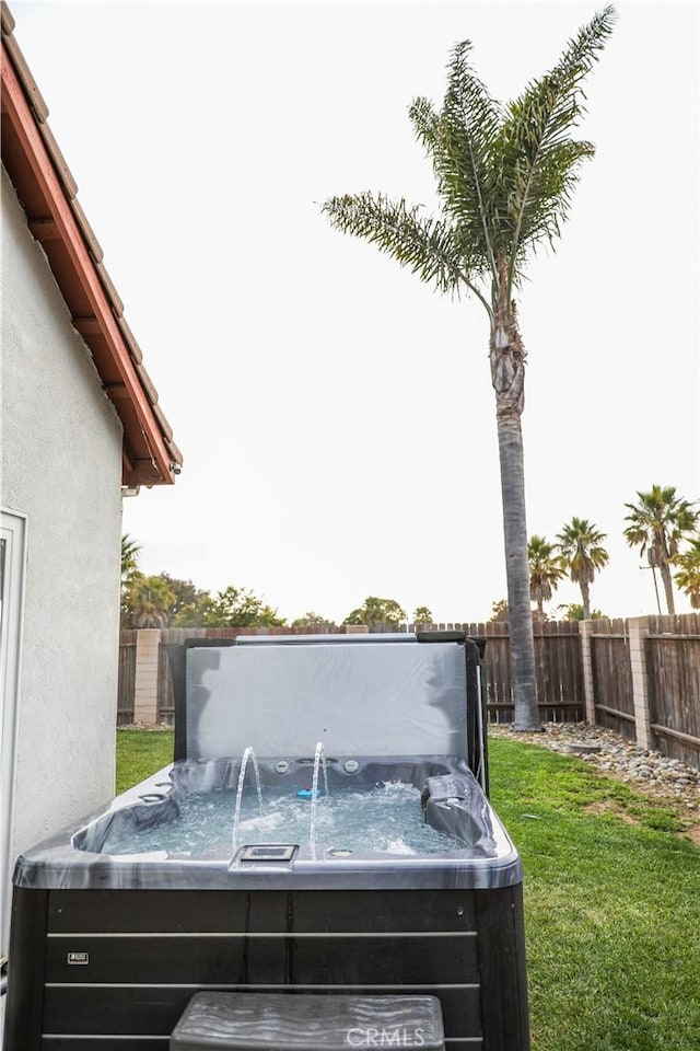 1639 La Selva Ave, Grover Beach, CA 93433 - exterior view of a hot tub, stucco siding, and a fenced backyard