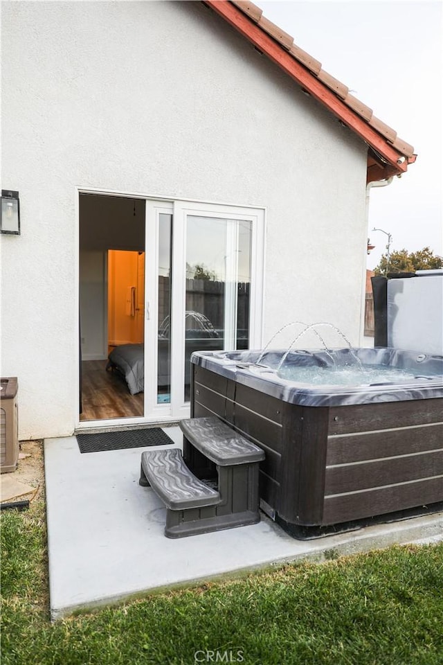 1639 La Selva Ave, Grover Beach, CA 93433 - back of property featuring a hot tub and stucco siding