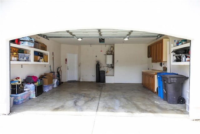 1639 La Selva Ave, Grover Beach, CA 93433 - garage featuring a garage door opener and water heater