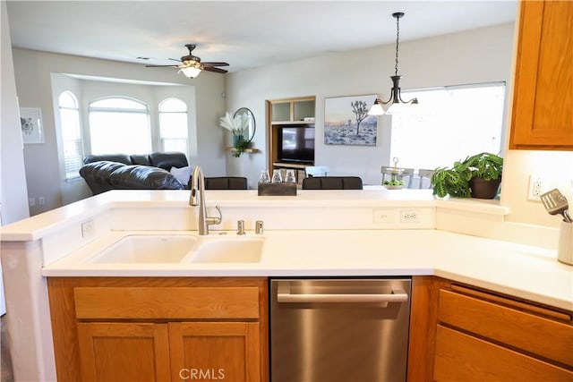 1639 La Selva Ave, Grover Beach, CA 93433 - kitchen with dishwasher, open floor plan, brown cabinetry, light countertops, and a ceiling fan