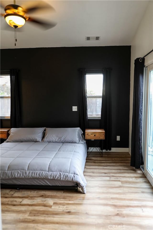 1639 La Selva Ave, Grover Beach, CA 93433 - bedroom featuring multiple windows, light wood finished floors, and a ceiling fan