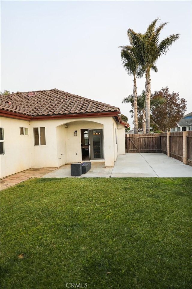 1639 La Selva Ave, Grover Beach, CA 93433 - back of house featuring a patio area, a tiled roof, a fenced backyard, and stucco siding