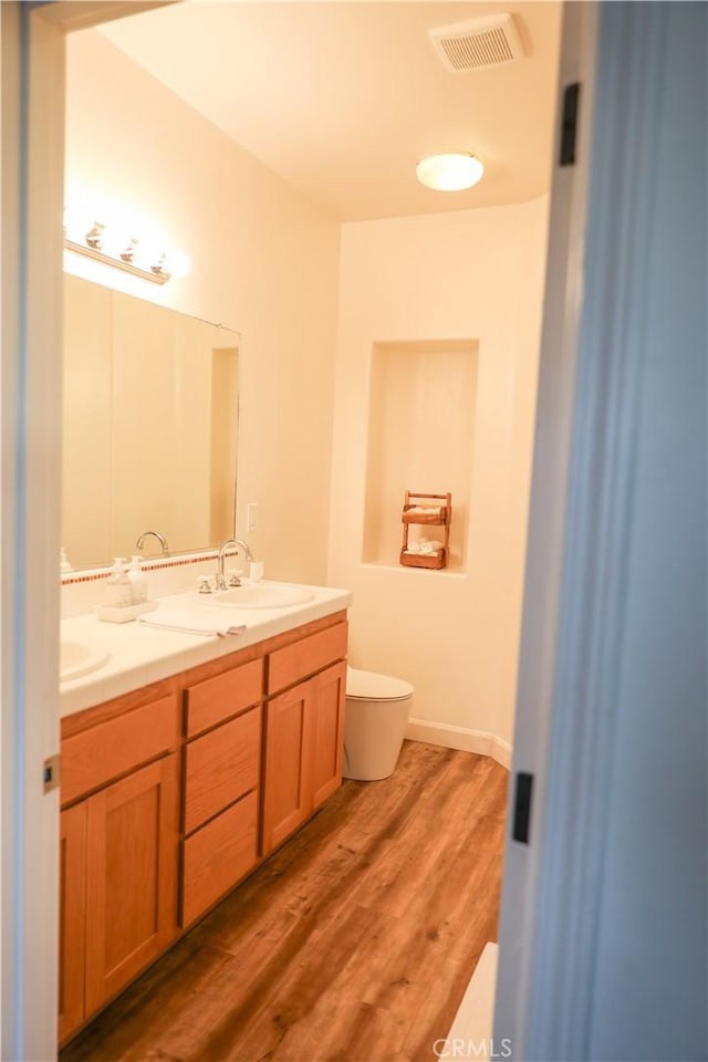 1639 La Selva Ave, Grover Beach, CA 93433 - bathroom featuring double vanity and wood finished floors