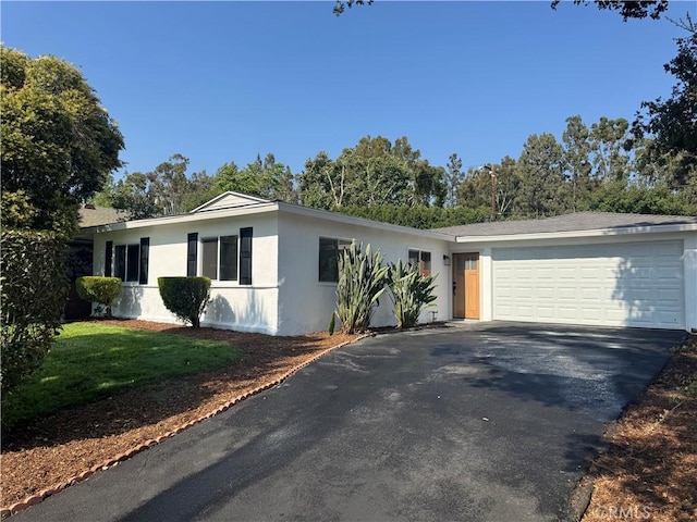 208 S Gaffney Ave, San Dimas, CA 91773 - single story home with asphalt driveway, a garage, stucco siding, and a front yard