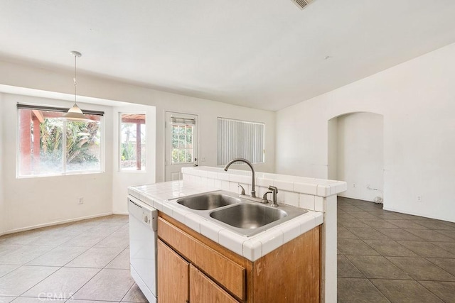 16205 Seville Ave, Fontana, CA 92335 - kitchen with tile countertops, dishwasher, light tile patterned floors, and decorative light fixtures