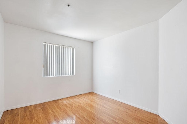 16205 Seville Ave, Fontana, CA 92335 - spare room featuring light wood-type flooring and baseboards