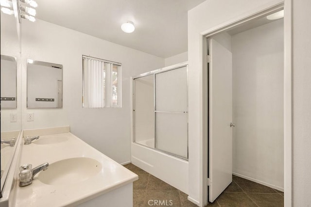 16205 Seville Ave, Fontana, CA 92335 - full bathroom featuring tile patterned flooring, double vanity, and bath / shower combo with glass door