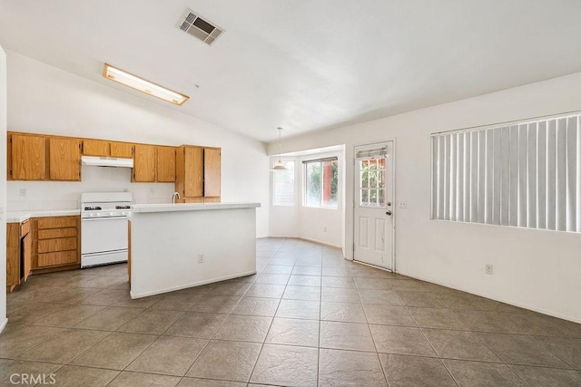 16205 Seville Ave, Fontana, CA 92335 - kitchen featuring white range with gas stovetop, light countertops, lofted ceiling, brown cabinetry, and tile patterned floors