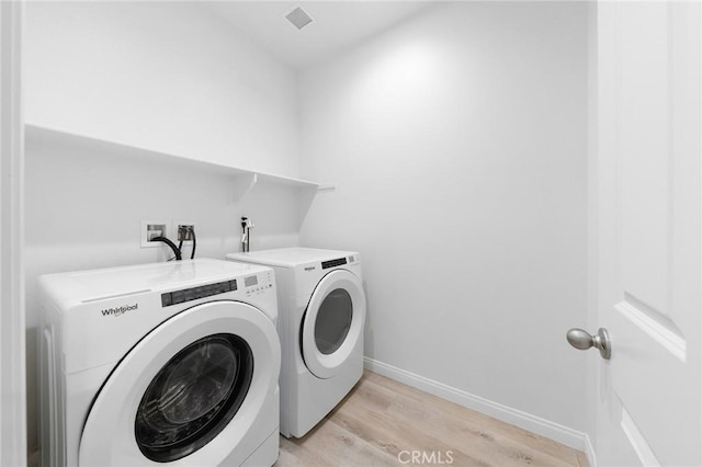 16471 Globetrotter St, Chino, CA 91708 - laundry room with washer and dryer and light wood finished floors