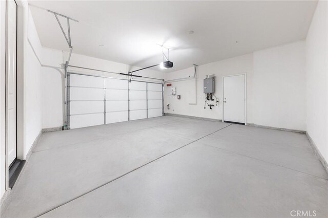 16471 Globetrotter St, Chino, CA 91708 - garage with a garage door opener and tankless water heater