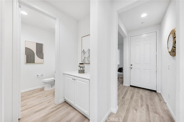 16471 Globetrotter St, Chino, CA 91708 - corridor with light wood-style floors and recessed lighting