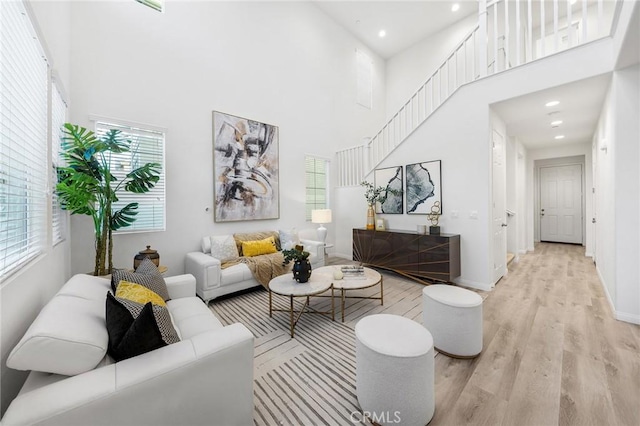 16471 Globetrotter St, Chino, CA 91708 - living area featuring wood finished floors, a towering ceiling, and recessed lighting