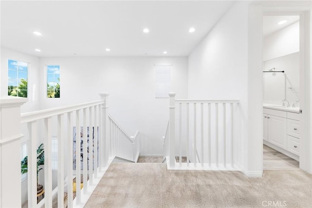 16471 Globetrotter St, Chino, CA 91708 - hallway with an upstairs landing, recessed lighting, and light carpet