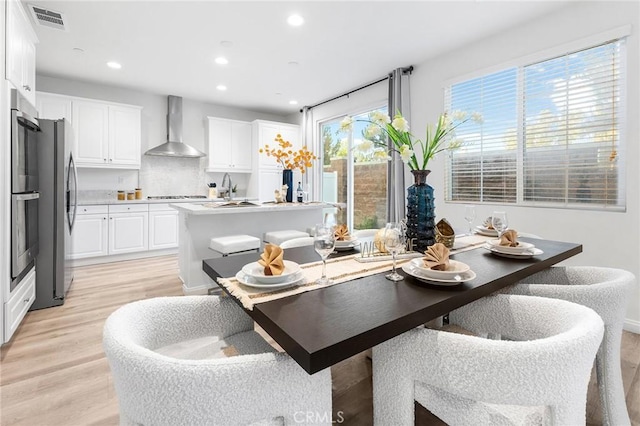 16471 Globetrotter St, Chino, CA 91708 - dining area with light wood-type flooring and recessed lighting