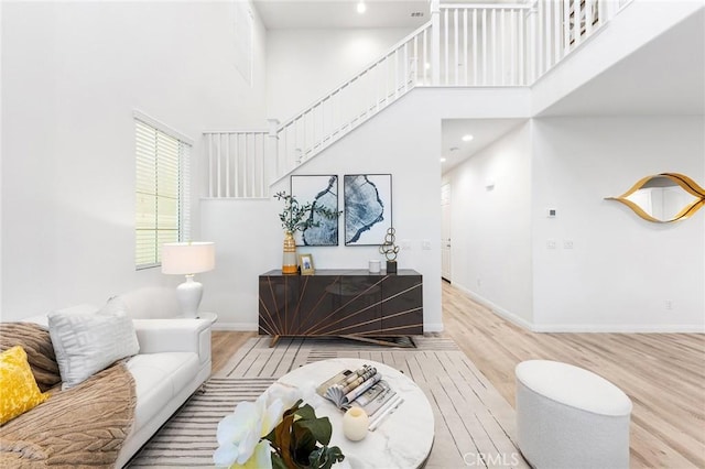 16471 Globetrotter St, Chino, CA 91708 - living area with wood finished floors, stairs, a towering ceiling, and recessed lighting