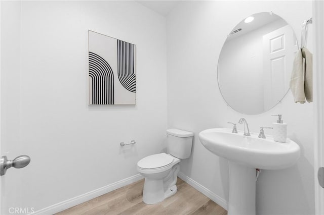 16471 Globetrotter St, Chino, CA 91708 - half bath featuring wood finished floors and toilet