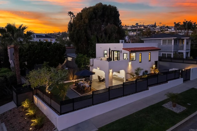 608 Forward St, La Jolla, CA 92037 - back of property with stucco siding, a balcony, and a patio