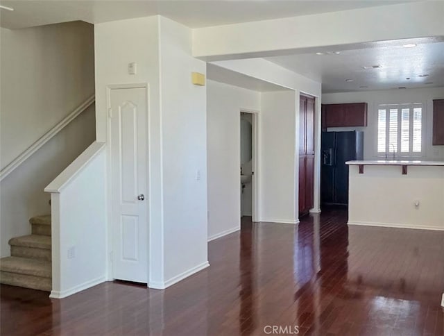 1652 Hickory Nut Pl, Chula Vista, CA 91915 - unfurnished living room with dark wood finished floors and stairs